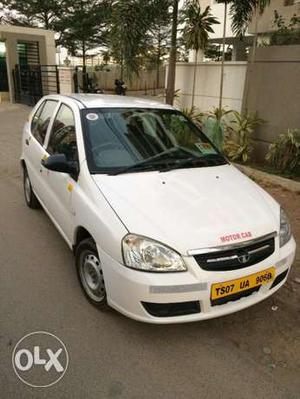 Tata Indica taxi plate with mobile device
