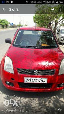 Swift car in red colour...wid alloy..tubeless