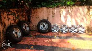 Four mahindra bolero tyres with disc and wheel cup 