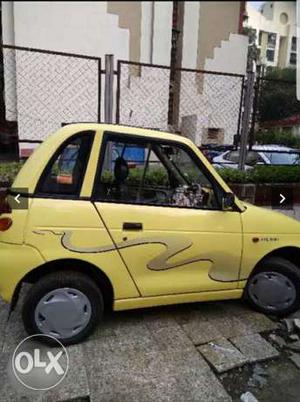 Yellow Reva Car with AC, Lady maintained,