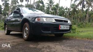  Mitsubishi Lancer petrol  Kms