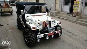 White jeep with many features like rear basket