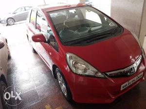 Red Honda Jazz on sale, done  Kms, in excellent