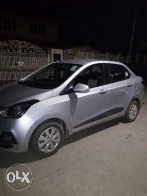 Hyundai xcent petrol  Kms  year silver coloured