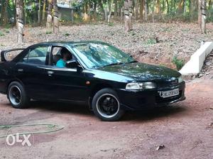  Mitsubishi Lancer petrol  Kms