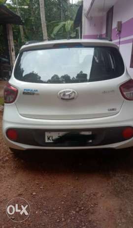 Hyundai Grand I 10 petrol  Kms showroom delivery 