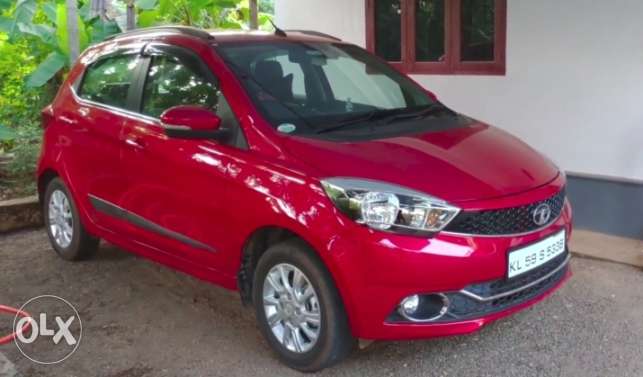 6 Months old Red Tata Tiago XZ full option with accessories