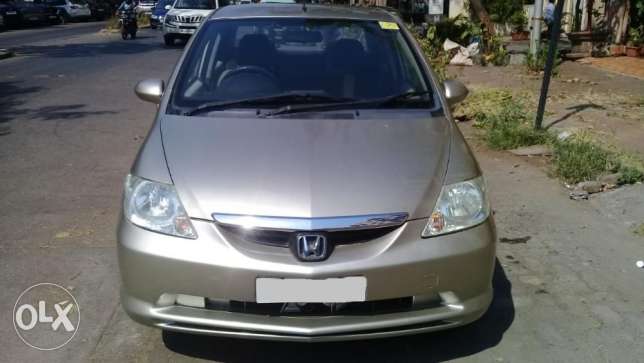 Honda City Zx Exi,yearnd owner,colour gold.
