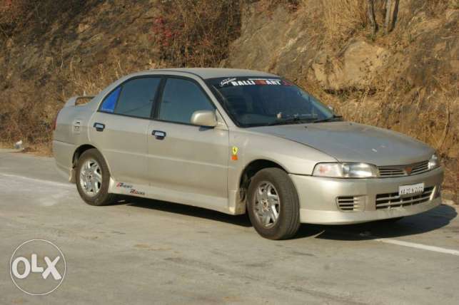  Mitsubishi Lancer petrol  Kms
